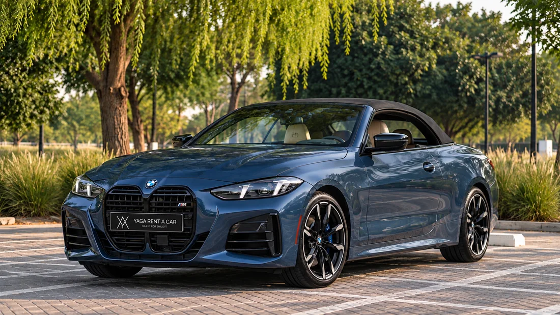 BMW 430i Convertible Blue — front three-quarter exterior beneath trees with the roof closed