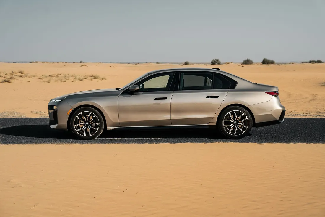 BMW 740i — grey side profile on the roadside