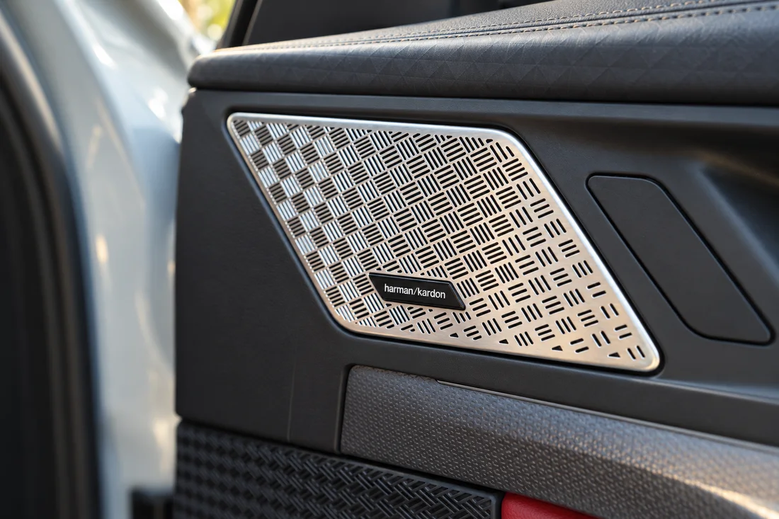 BMW X2 White — door speaker grille close-up