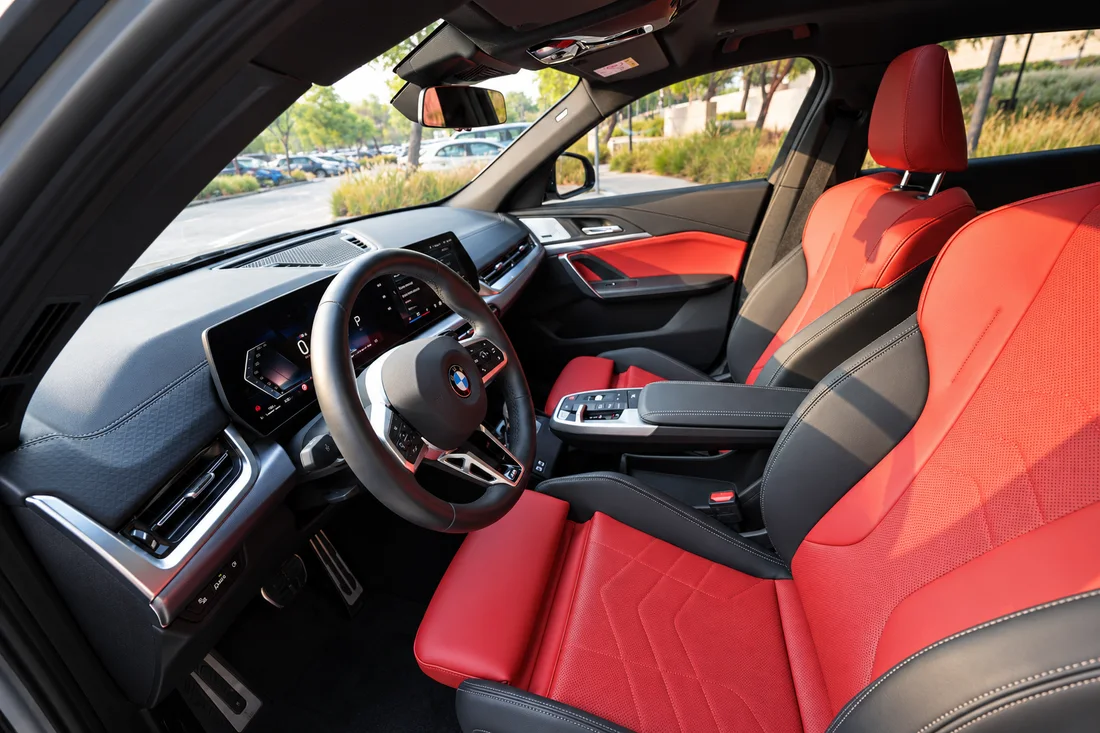 BMW X2 White — driver cockpit and red front seats
