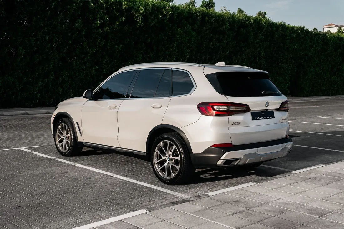 BMW X5 xDrive 40i — rear three-quarter exterior with tailgate visible