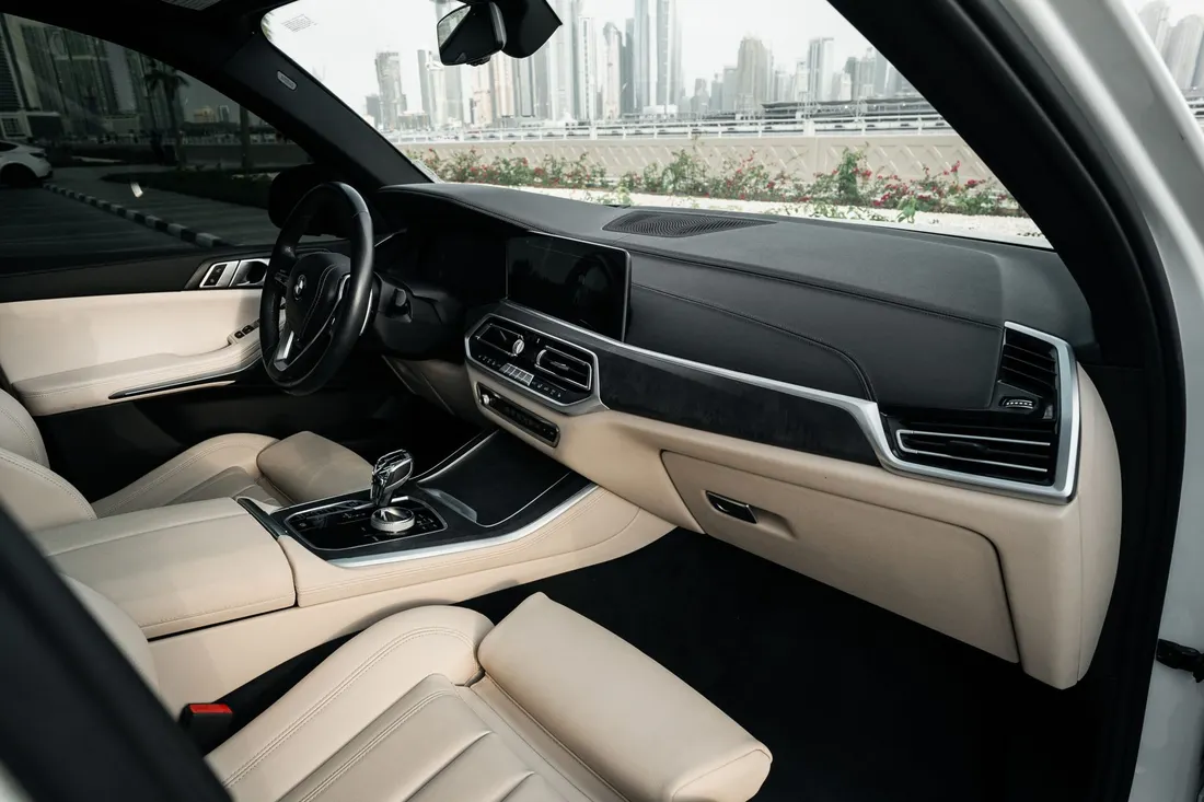 BMW X5 xDrive 40i — beige front passenger seat and dashboard