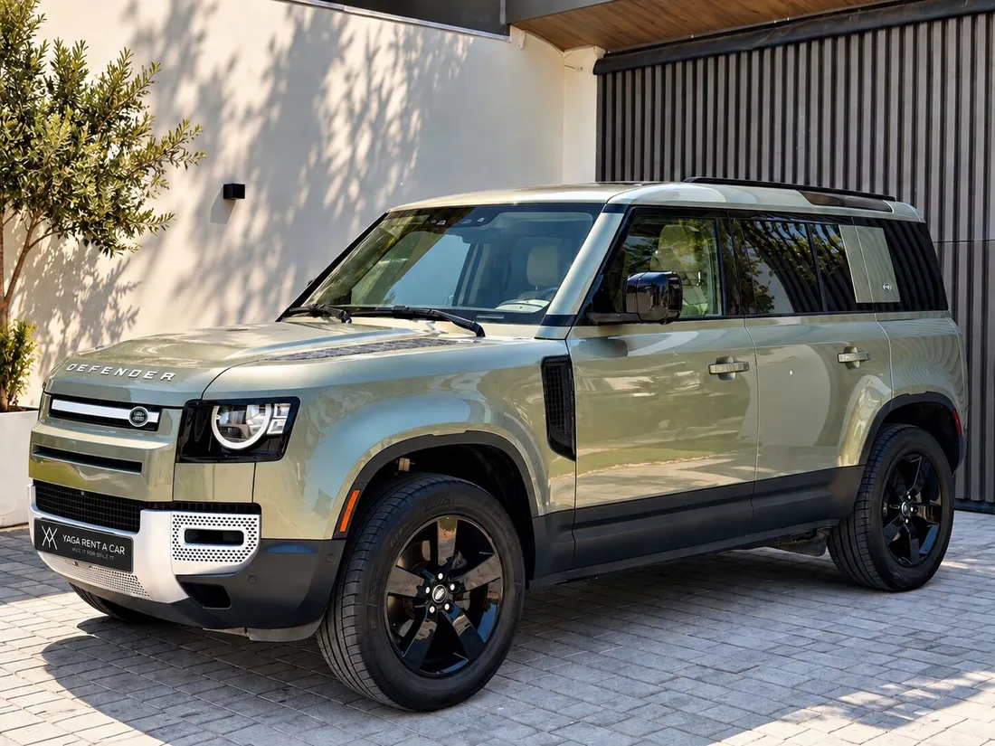 Land Rover Defender 7 Seats — opposite front three-quarter exterior and black wheels