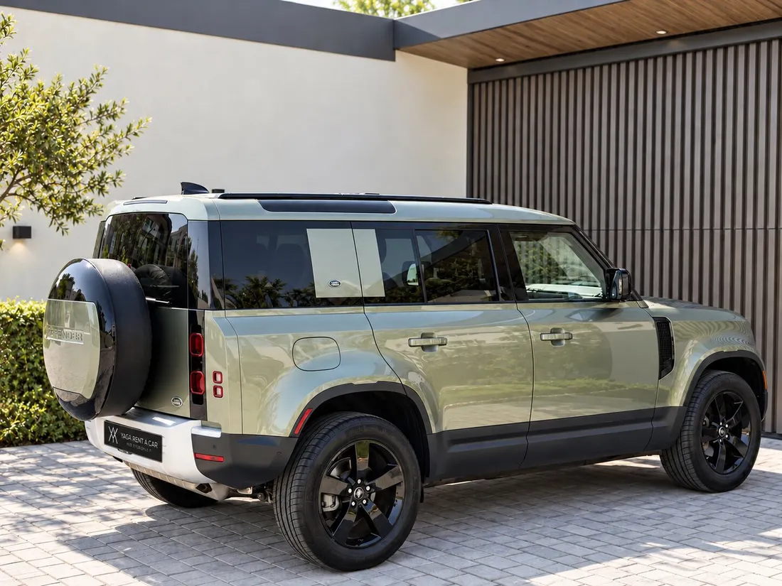 Land Rover Defender 7 Seats — rear three-quarter exterior and spare-wheel cover