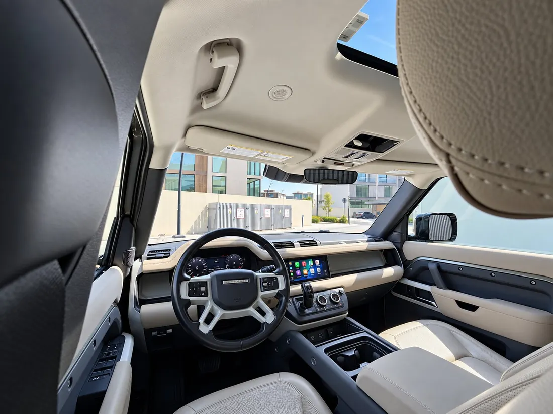 Land Rover Defender 7 Seats — dashboard viewed between the front headrests