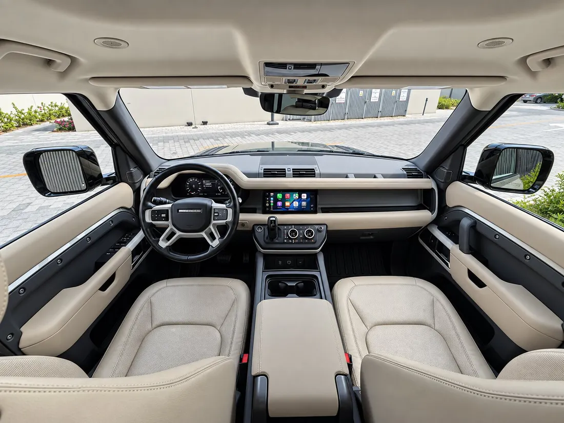 Land Rover Defender 7 Seats — full front cabin and dashboard from behind the seats