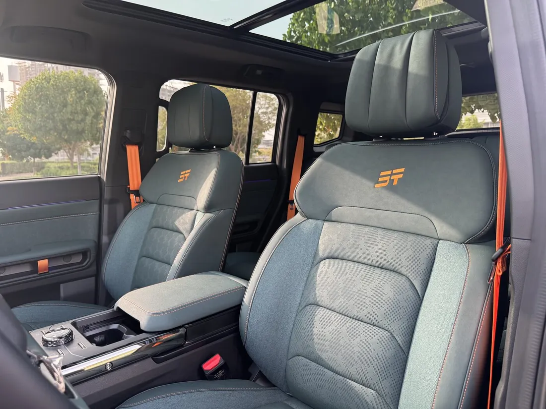 Jetour T2 Green Interior — front seats with orange embroidered trim