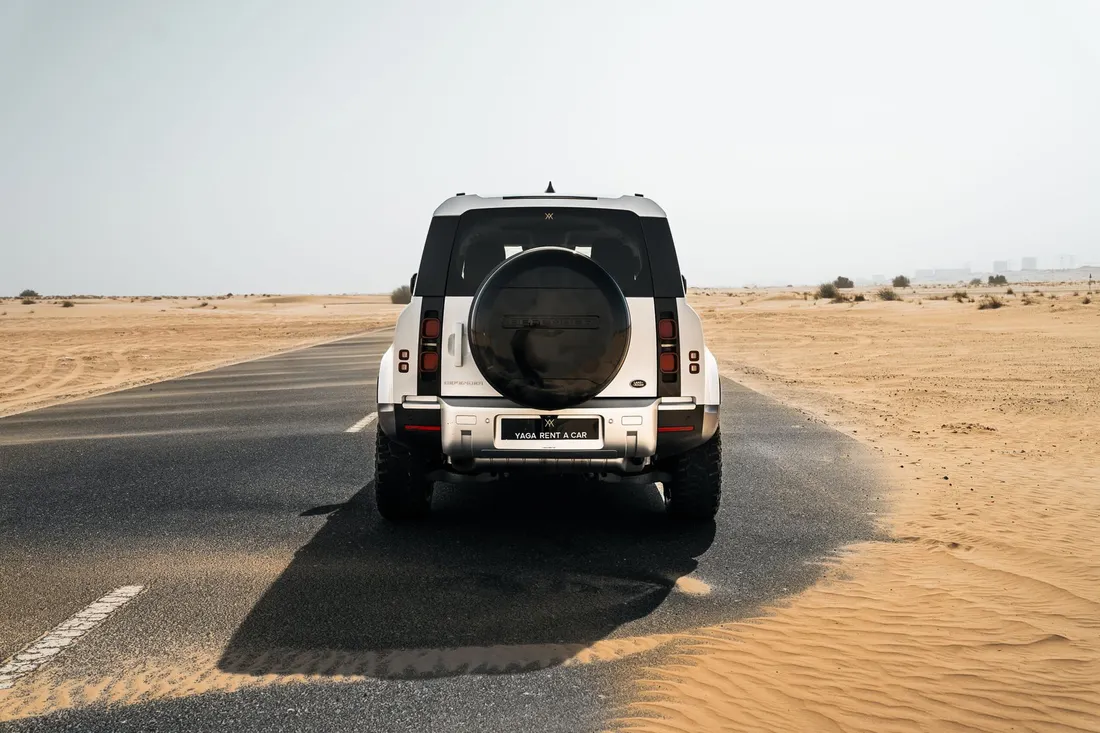 Land Rover Defender — rear exterior with tailgate-mounted spare wheel