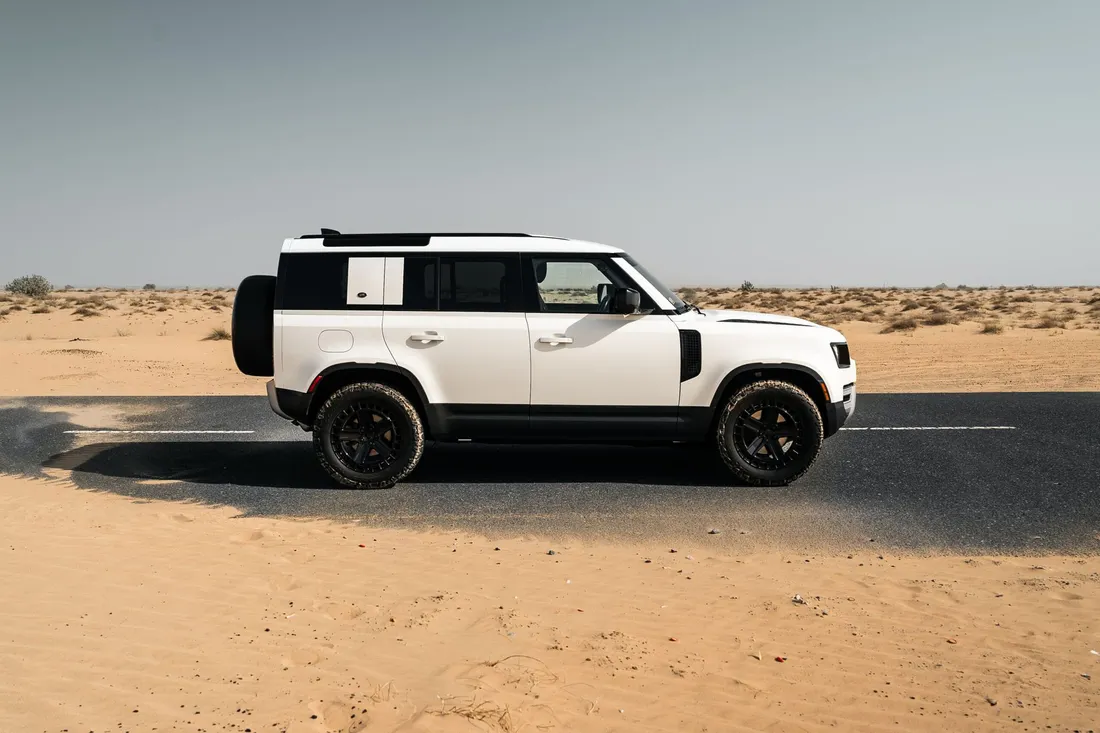 Land Rover Defender — side profile and black wheels