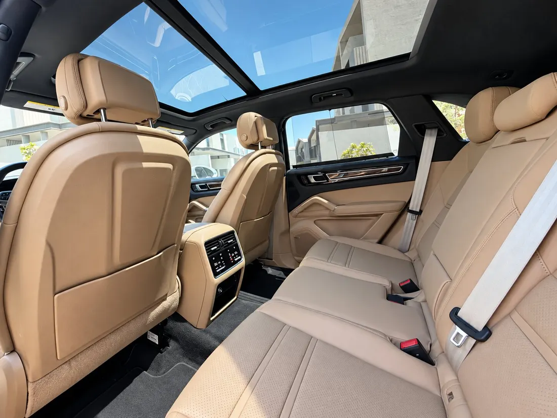 Porsche Cayenne S — beige rear seating beneath the glass roof