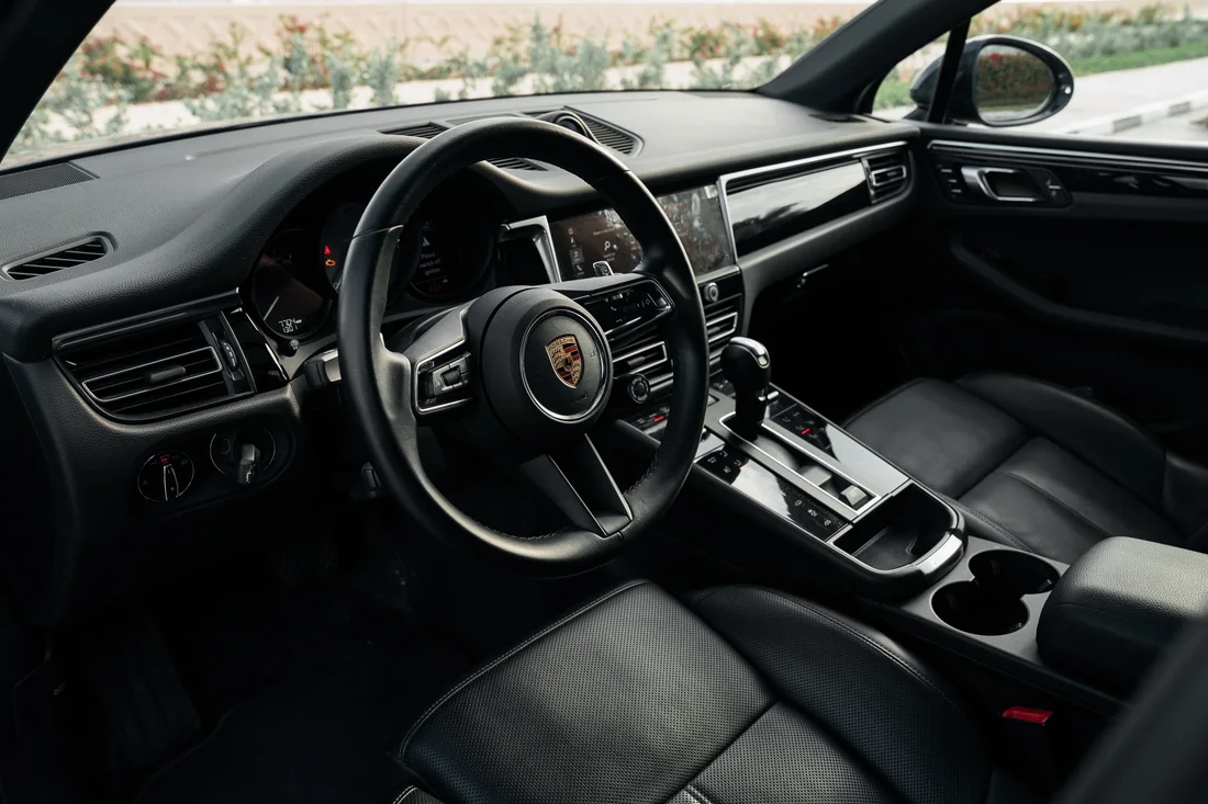 Porsche Macan S — black front seats and driver cockpit